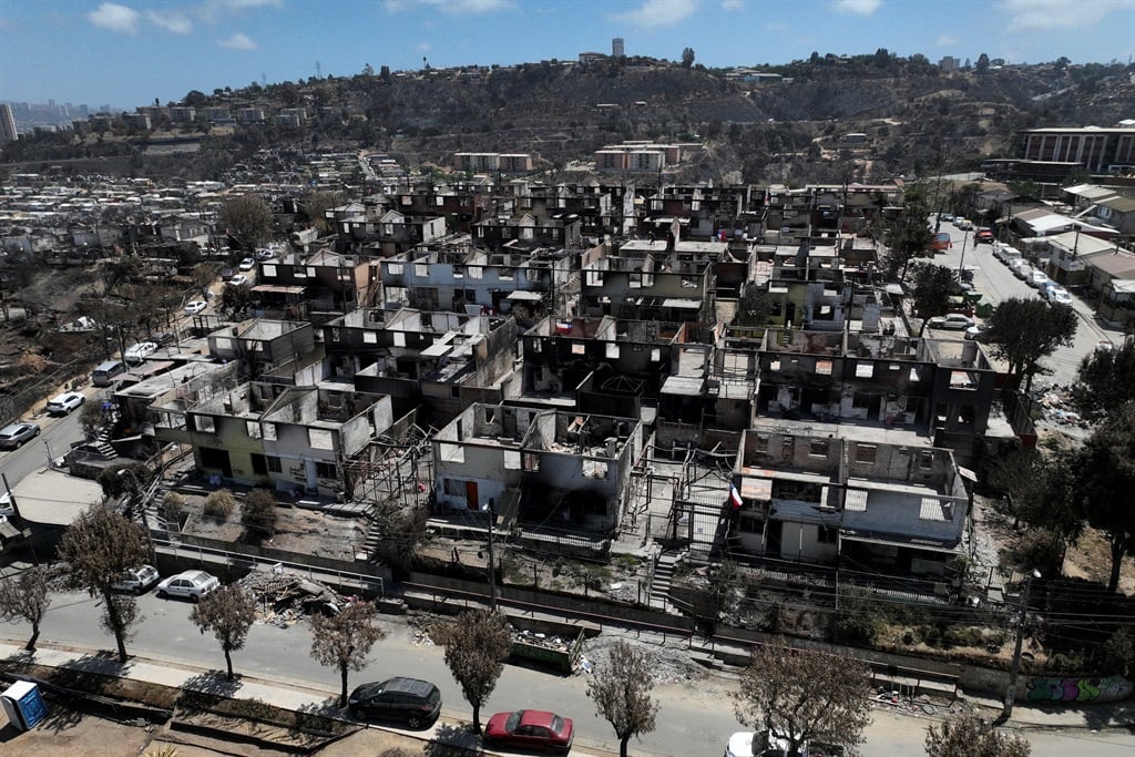 Aerial view of burned houses after a forest fire in the El Olivar neighbourhood, Viña Del Mar, Chile, taken on 8 February 2024. Firefighters said Wednesday they had extinguished all wildfires in Chile's coastal region of Valparaiso, where flames razed entire communities and left 131 dead. (Photo by Javier Torres / AFP)