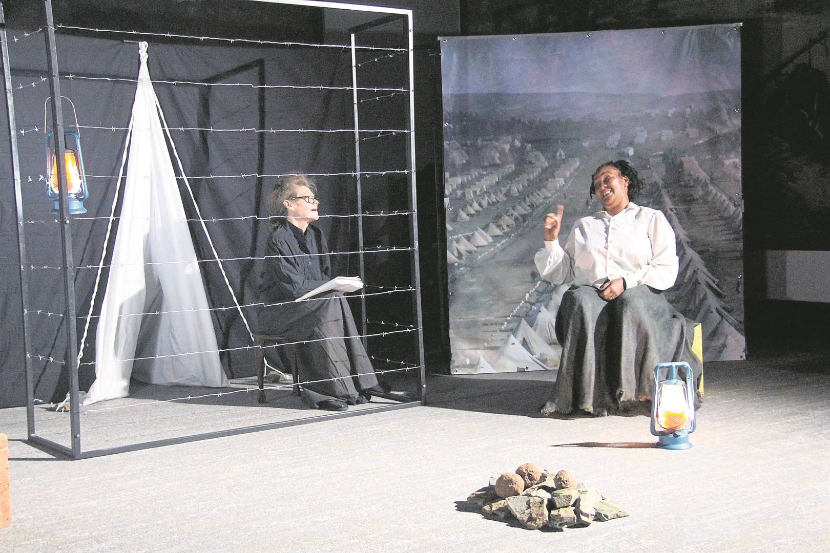 Carin van Deventer (left) in the role of Aletta, and Maria de Koker in the role of Naledi, in the new production The Cage, which was performed for the first time at the War Museum of the Boer Republics on Friday, 19 April. The play was written by Dr André van Deventer and is set in the Bethulie Concentration Camp during the Anglo-Boer War.Photo: Lientjie Mentz