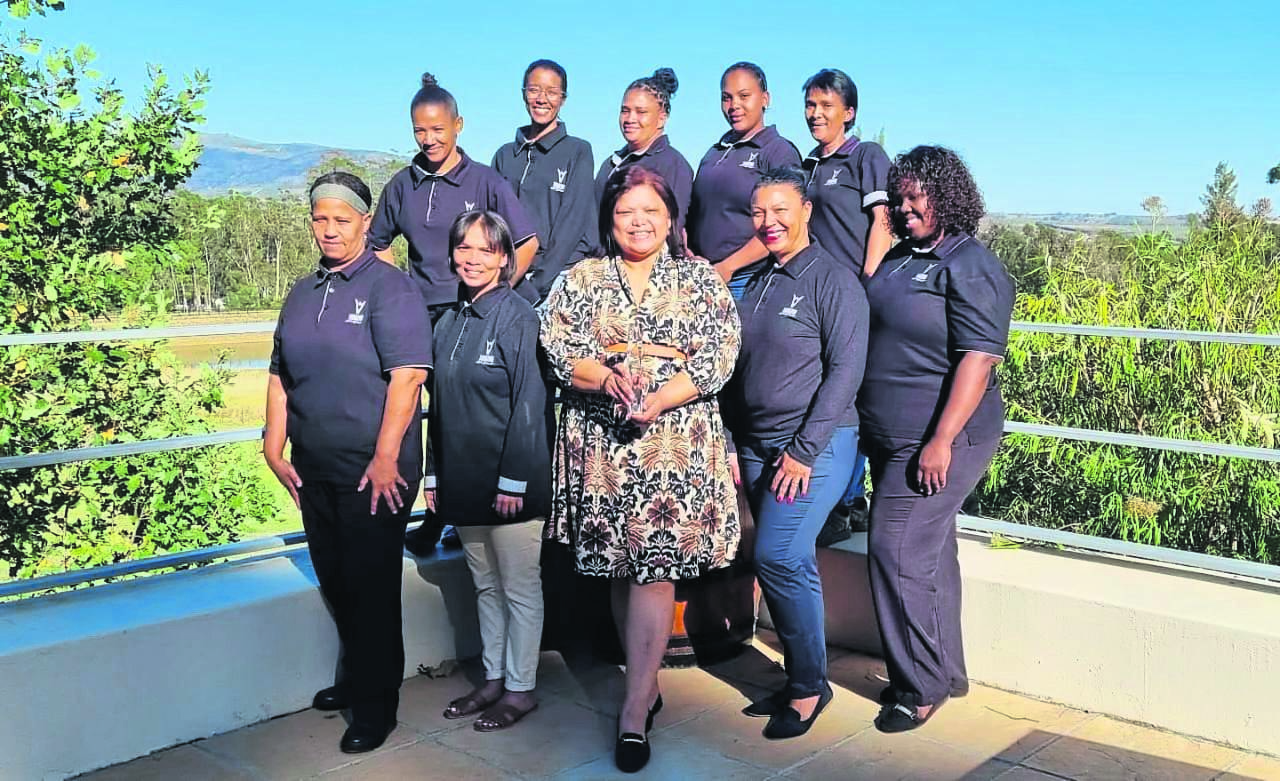 Denis Stubbs the day after her Fedhasa Leader of the Year win. Here Stubbs, managing director of Thokozani Wines & Hospitality, is flanked by the rest of the staff.