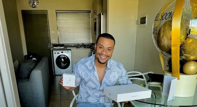 Singer and reality star Sinaye Kotobe receives a cheque from his fans. Photo from X
