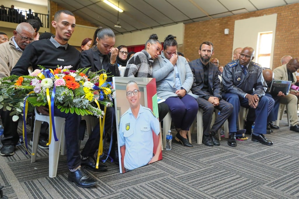 Family of police officer Sergeant Adian Mahoney at his memorial. (Supplied/SAPS)