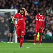 Liverpool's title push dented by local rivals