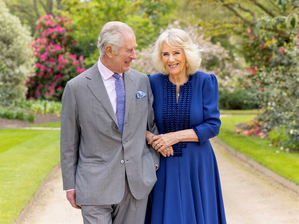 A handout photo issued by the Royal Household on April 26, 2024 shows Britain's King Charles III and Queen Camilla in the garden of Buckingham Palace in London, on 10 April. (Millie Pilkington/Buckingham Palace/AFP) 