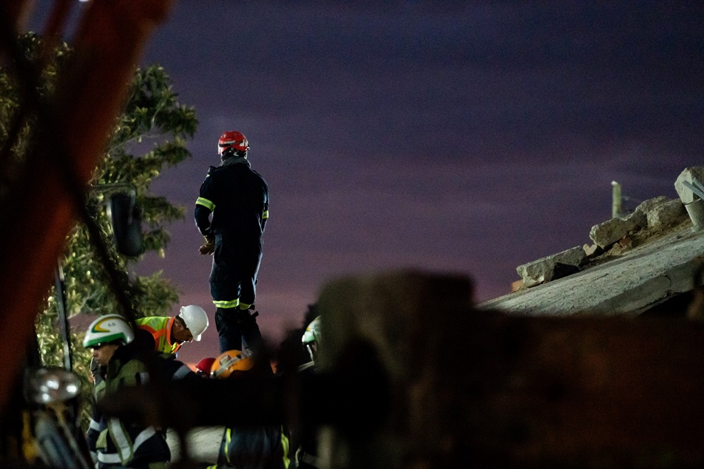 Heroes among the rubble: Rescuers continue to search for survivors at ...