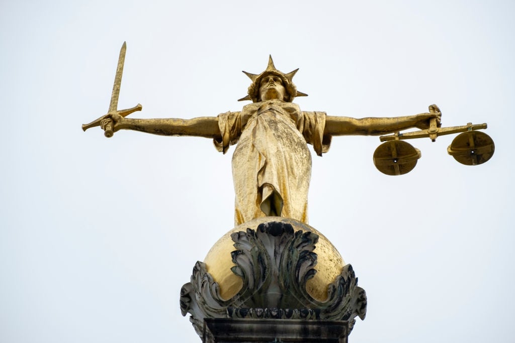 The Lady of Justice statue atop the Central Criminal Court in England, commonly known as the Old Bailey, in April 2024. (Mike Kemp/In Pictures via Getty Images)
