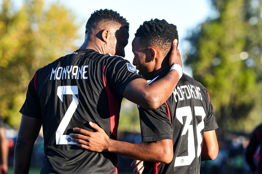 Orlando Pirates teammates Thabiso Monyane and Relebohile Mofokeng embrace one another (Darren Stewart/Gallo Images)