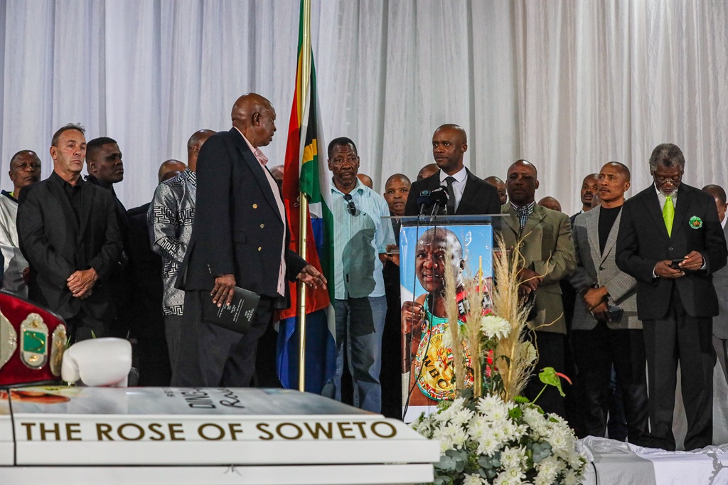Mourners pay their last respects at the funeral of Dingaan Thobela. 