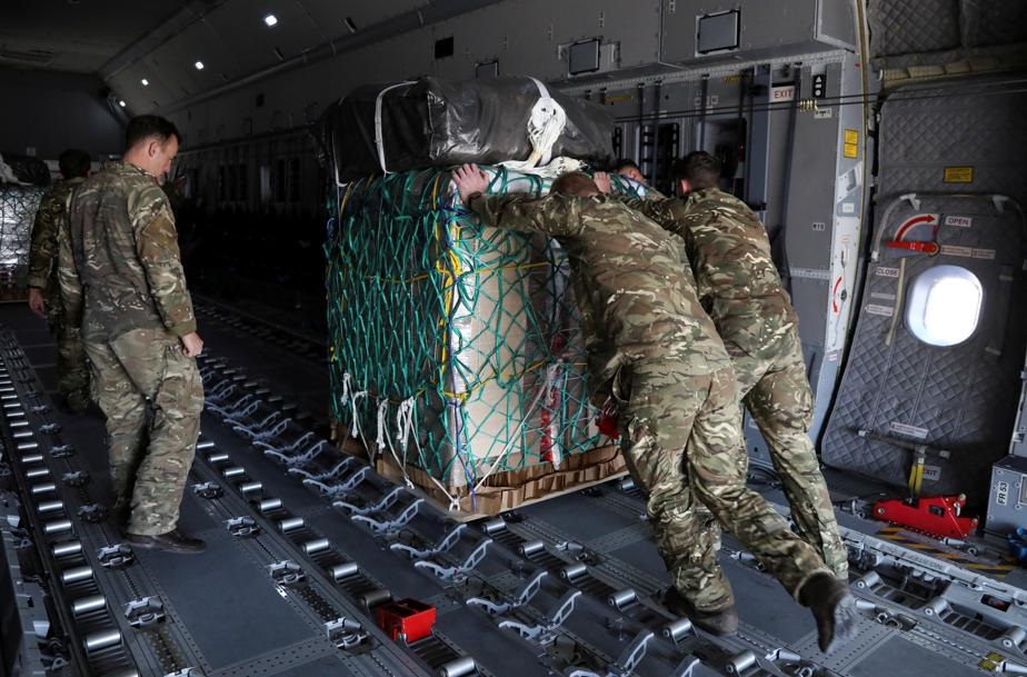 British military personnel load aid parcels into a plane that will be airdropped over Gaza, in Zarqa , Jordan May 9, 2024. Photo by REUTERS
