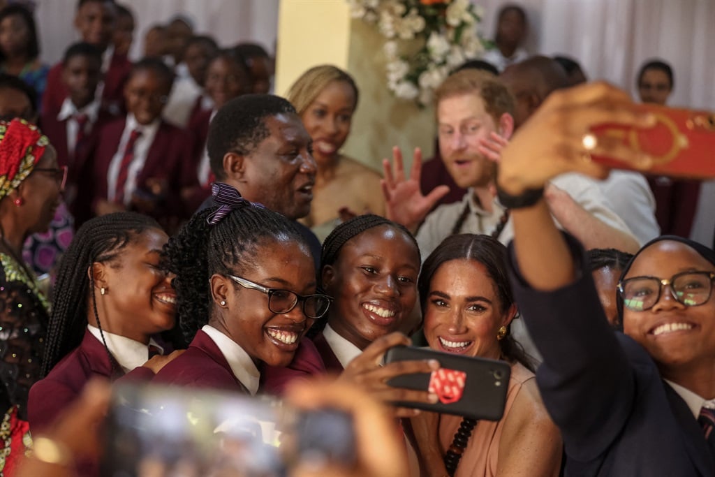 Britain's Meghan, Duchess of Sussex (1st row 2nd R