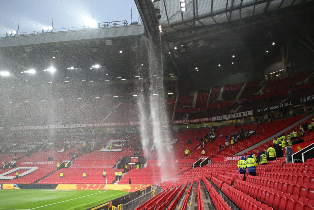 A general view of Old Trafford as the drainage pipe in the roofs of the Sir Alex Ferguson Stand and East Stand leaks and pours onto the seats below following heavy rainfall after the Premier League match between Manchester United and Arsenal. (Michael Regan/Getty Images)