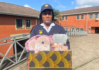 'Do something out of love': KZN cop praised for caring for 2-year-old girl left at station