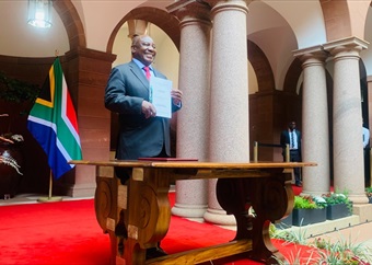 'We're not mad,' Ramaphosa assures SA as he signs the controversial NHI Bill into law
