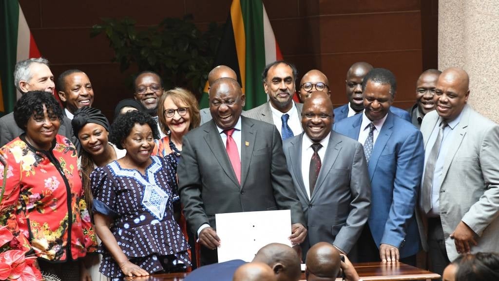 President Cyril Ramaphosa and delegates are seen at the public signing into the law of the National Health Insurance Bill at the Union Buildings on 15 May 2024 in Pretoria. The bill aims to direct the transformation of South Africa's health care system to achieve universal coverage for health services and overcome critical socioeconomic imbalances and inequities of the past