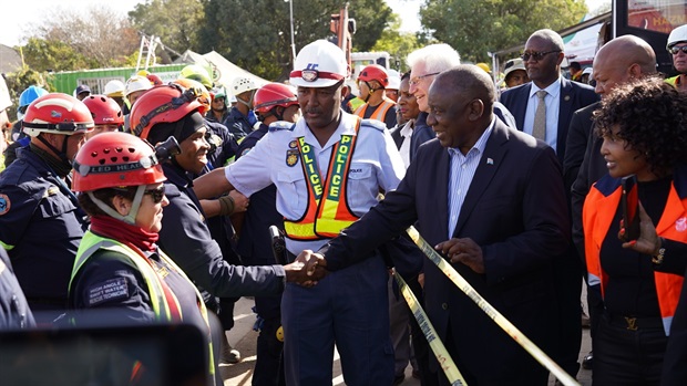 President Cyril Ramaphosa shaking hands with the K9 Unit working at the George building collapse scene on Thursday.&nbsp;<em>(Photo by Alfonso Nqunjana/News24)</em>