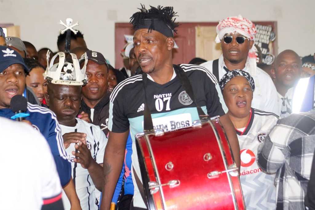 Hamilton "DrumBoss" Zulu with fellow Orlando Pirates supporters 