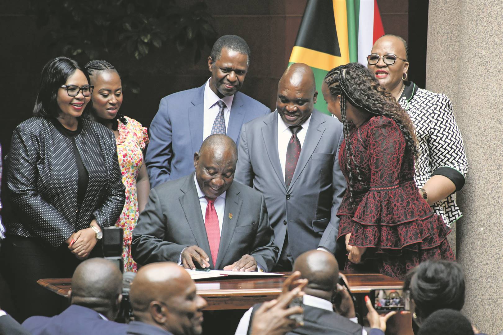 Cyril Ramaphosa and Joe Phaahla at the public signing into law of the NHI Bill.
