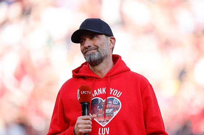 Jurgen Klopp speaks to the Anfield faithful after his final match in charge of Liverpool (James Baylis - AMA/Getty Images)