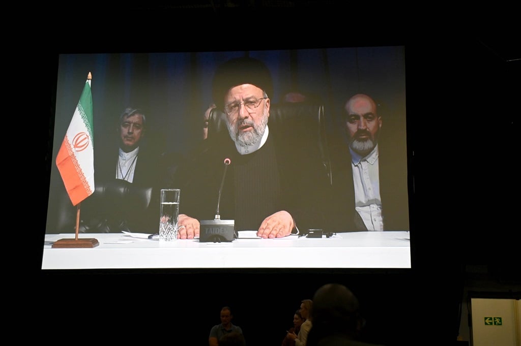 Iran President Ebrahim Raisi seen on screen during the BRICS Summit at the Sandton Convention Centre on 24 August 2023 in Johannesburg. (Deaan Vivier/Gallo Images/Beeld)