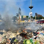 Watch | Trash piles up streets as workers down tools