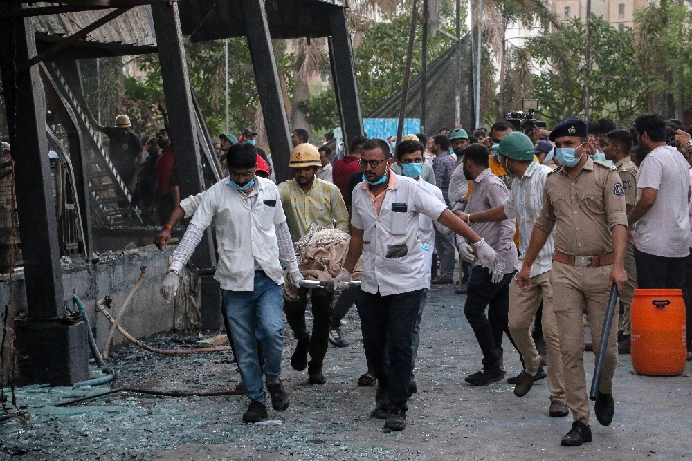 Rescue workers remove victims from a fire at an amusement park in Rajkot, Gujarat, India, on May 25, 2024. (AFP)