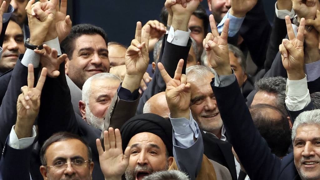 New Iranian President Masoud Pezeshkian (C-R) and 