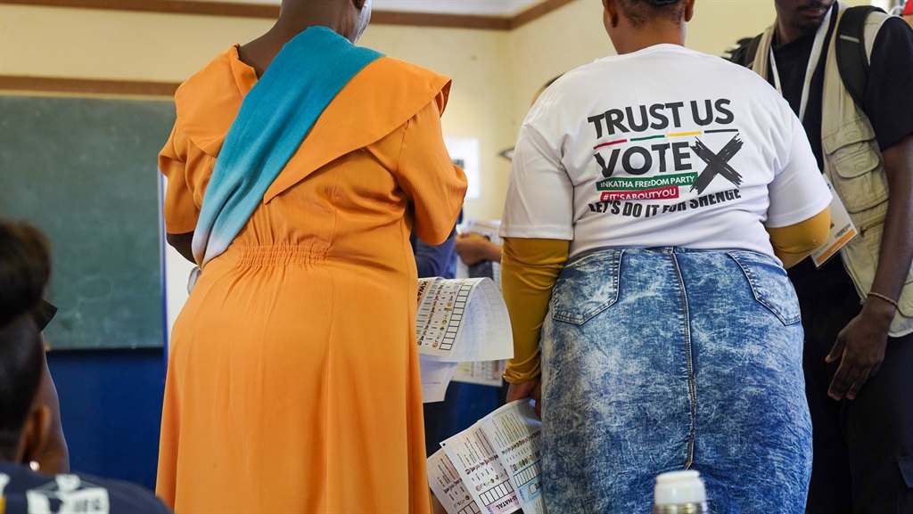 Residents in Nkandla holding ballot papers as they