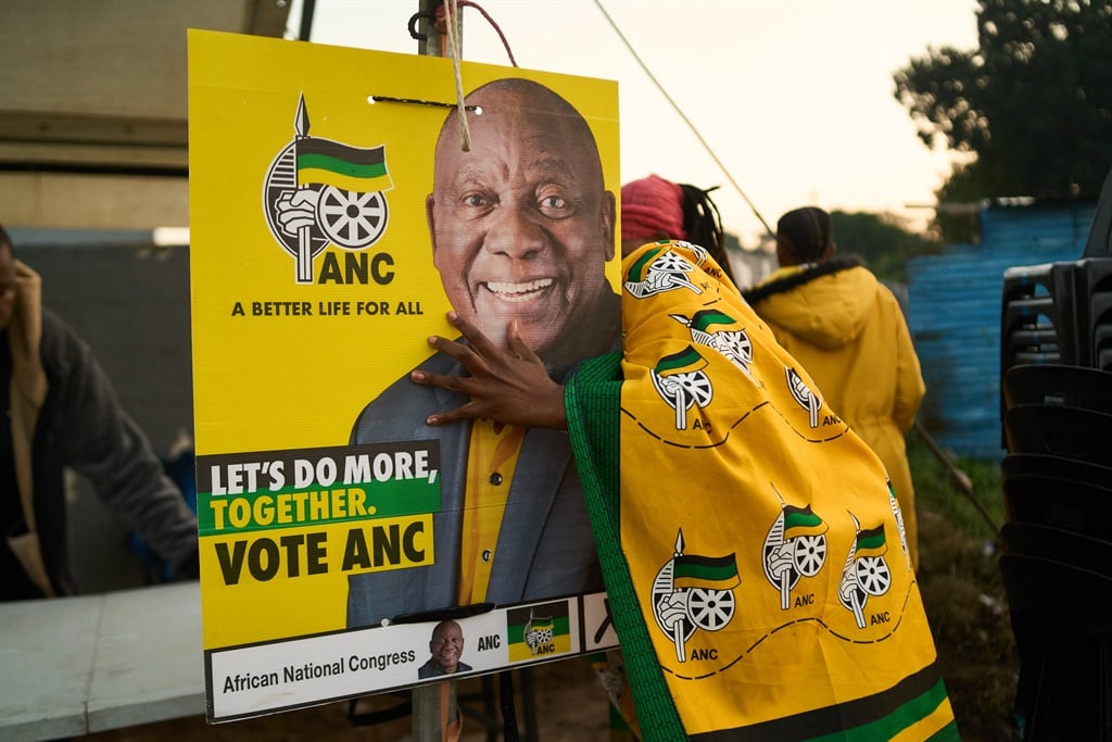 African National Congress (ANC) polling agents set up a tent decorated with party paraphernalia outside a polling station in Umlazi on 29 May. (Zinyange Auntony / AFP)