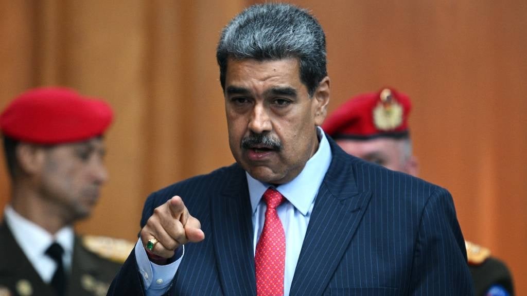 Venezuelan President Nicolas Maduro gestures as he leaves a press conference to the international media about the presidential election at the Miraflores presidential palace in Caracas. (Federico Parra/AFP)