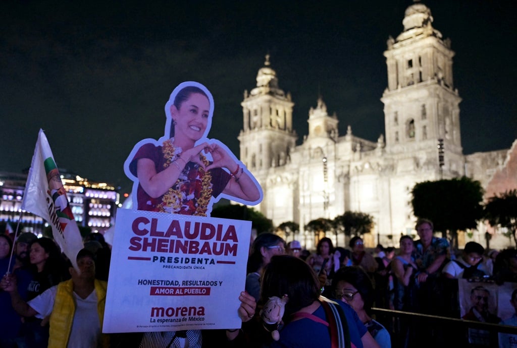 Supporters of Mexico's Morena Party presidential candidate Claudia Sheinbaum wait for her in Zocalo Square on election day in Mexico City on June 2, 2024. Claudia Sheinbaum would be elected Mexico's first female president, exit polls showed , a milestone in a country with a history of gender-based violence.  (Yuri Cortés/AFP)