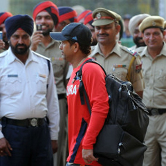Sachin Tendulkar was watched over by several police officers as he left the PCA Stadium. (AFP)