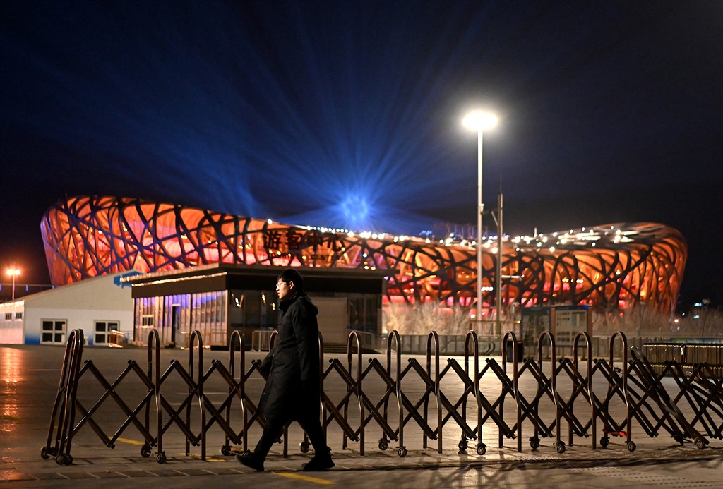 A security personnel walks near the Bird's Nest stadium, the venue for the opening and closing ceremonies for the 2022 Winter Olympics in Beijing on December 30, 2021.
Noel Celis / AFP