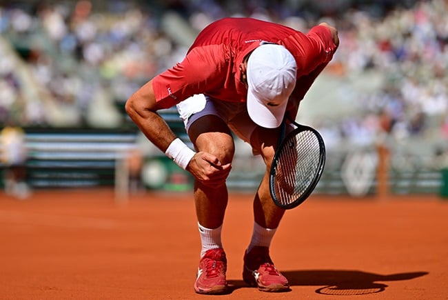 Djokovic on crutches but says knee operation went well