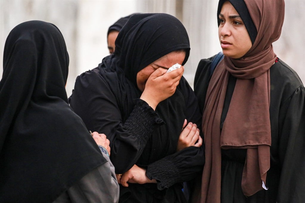 Palestinians react at a UN-school housing displaced people that was hit during Israeli bombardment in Nuseirat, in the central Gaza Strip, amid the ongoing conflict between Israel and the Palestinian Hamas militant group. ( Bashar Taleb / AFP)