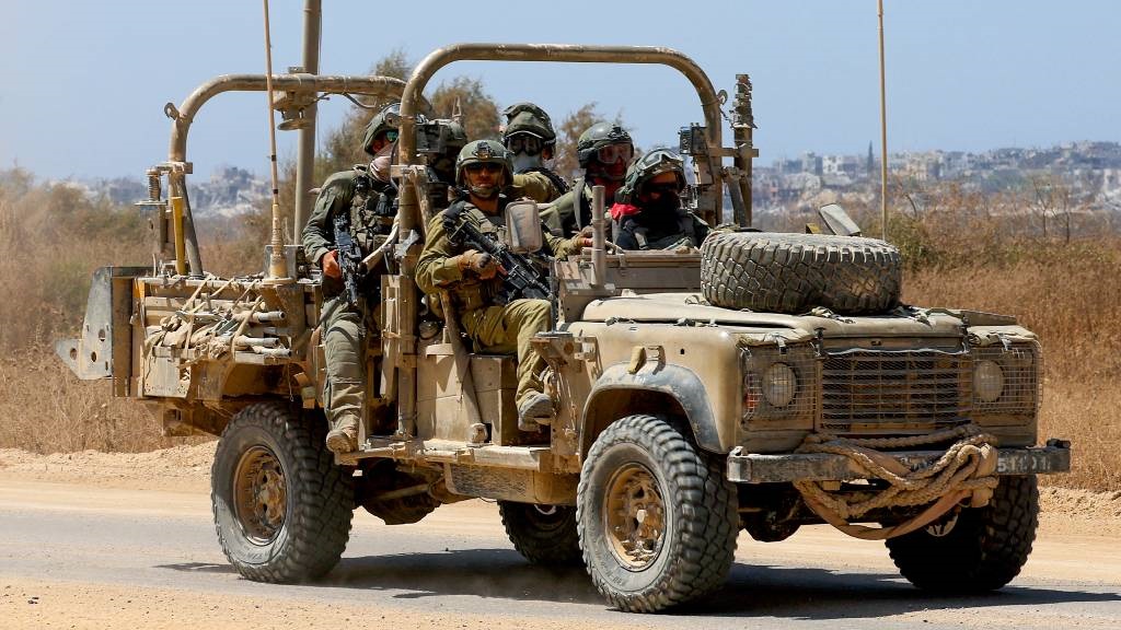 An Israeli army vehicle moves along Israel's south