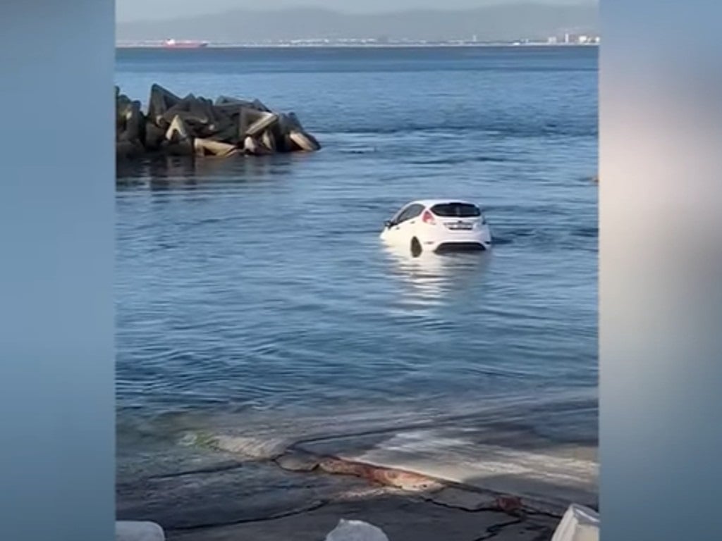 News24 | WATCH | That sinking feeling: Narrow escape as car slides into the sea at Cape Town boat club