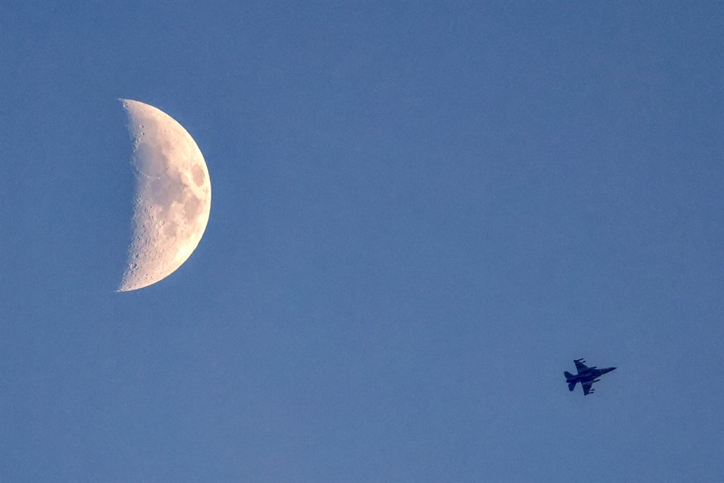 This picture taken from a position in northern Israel near the border with Lebanon shows an Israeli Air Force fighter flying over the border area on 11 August 2024, amid ongoing cross-border clashes between Israeli troops and Hezbollah. (Jalaa Marey / AFP)