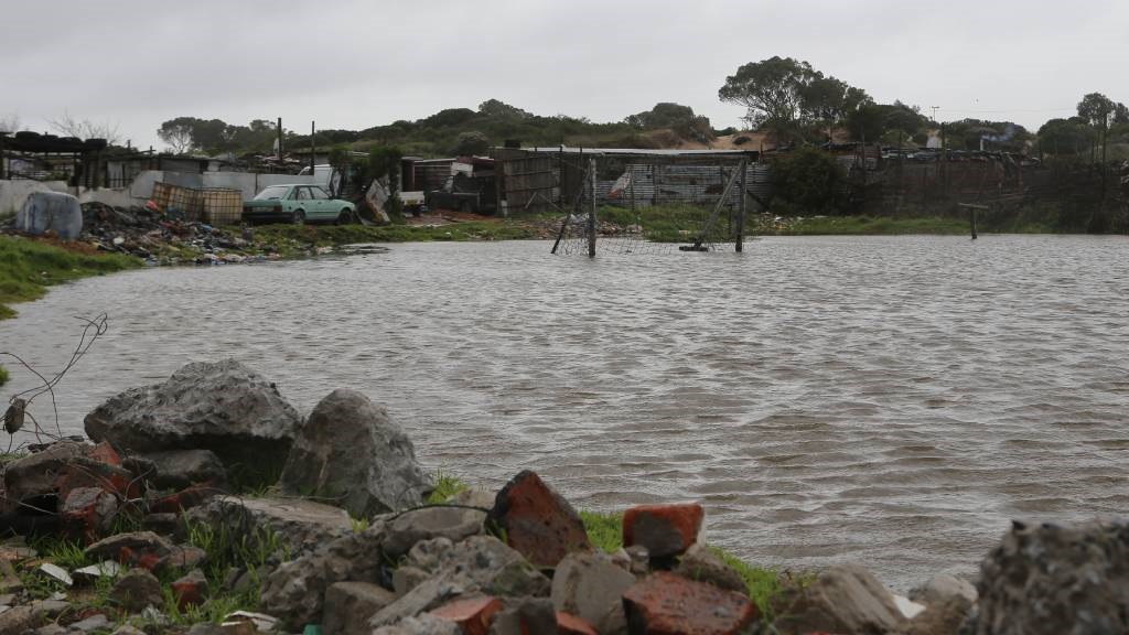 A flooded football field on Oasis Farms is seen in