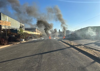 Angry Alexandra residents block roads, burn tyres over extended power outages in cold weather