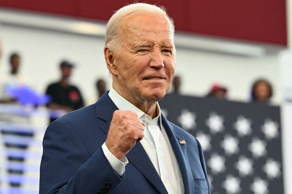 US President Joe Biden pumps his fist after speaking at a campaign event at Renaissance High School in Detroit, Michigan, on 12 July 2024. (Mandel Ngan/AFP)