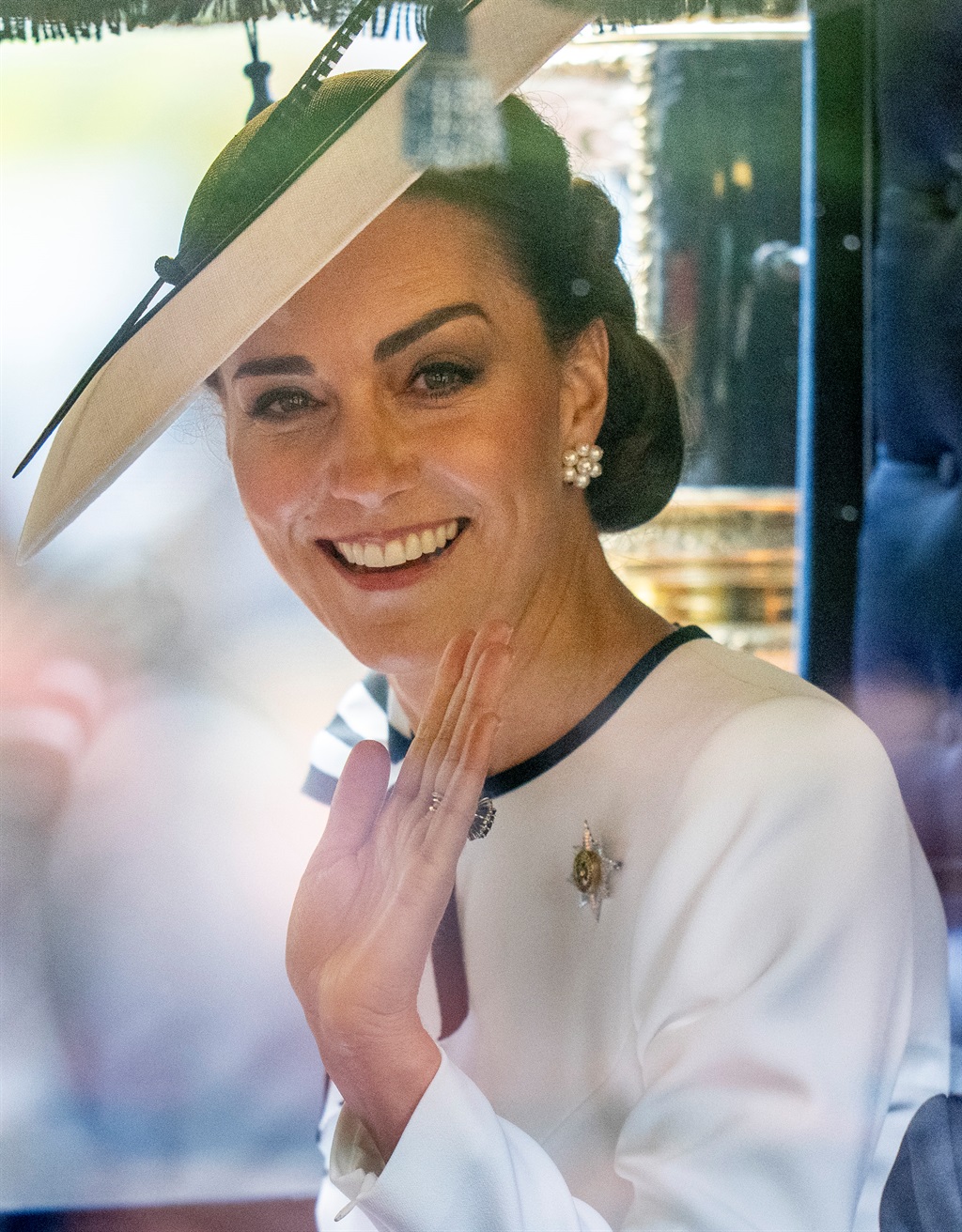 Catherine, Princess of Wales waves during Trooping