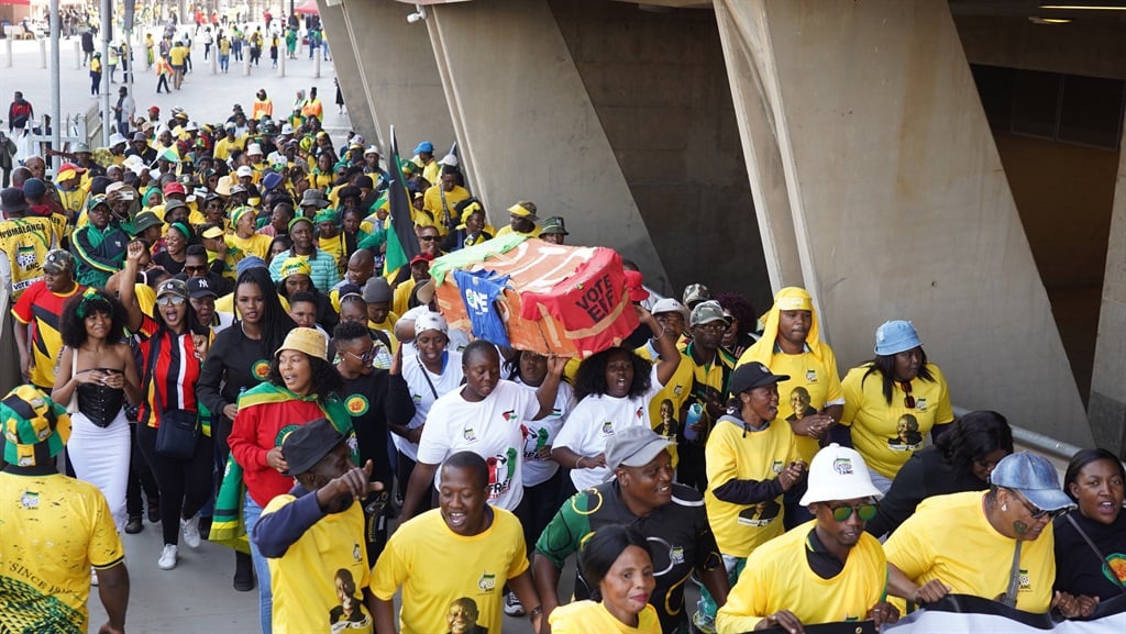 ANC supporters hold a coffin aloft representing EFF, Action SA and the DA at the party's last rally before the 29 May elections at FNB stadium, Johannesburg. (Photo: Alfonso Nqunjana/News24) 