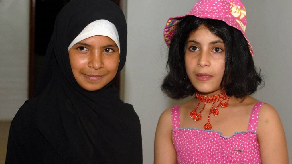 Yemeni child brides, 8-year-old Nojud Ali (L) and 