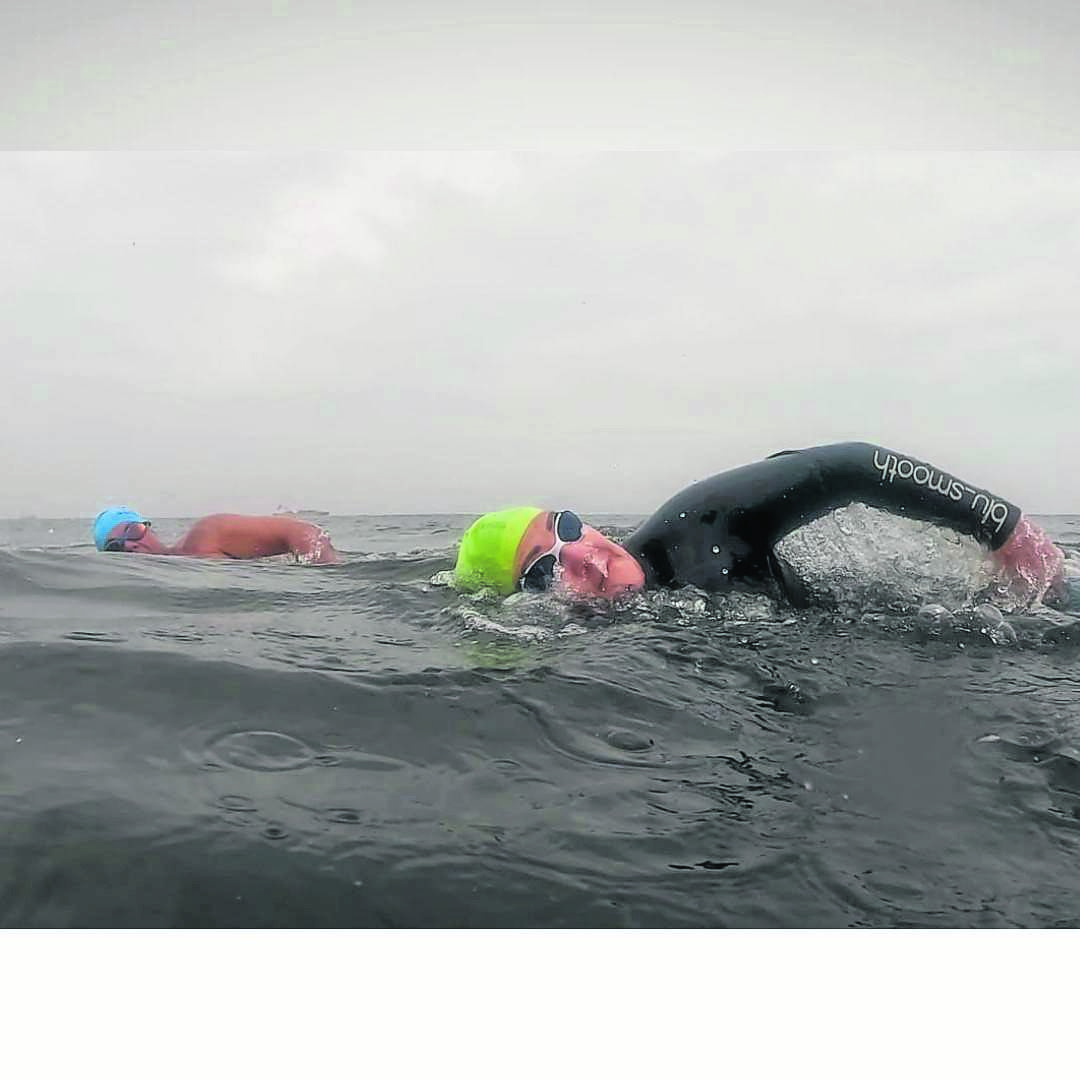 News24 | Fish Hoek teacher joins record-breaking athlete to complete Robben Island swim for animals