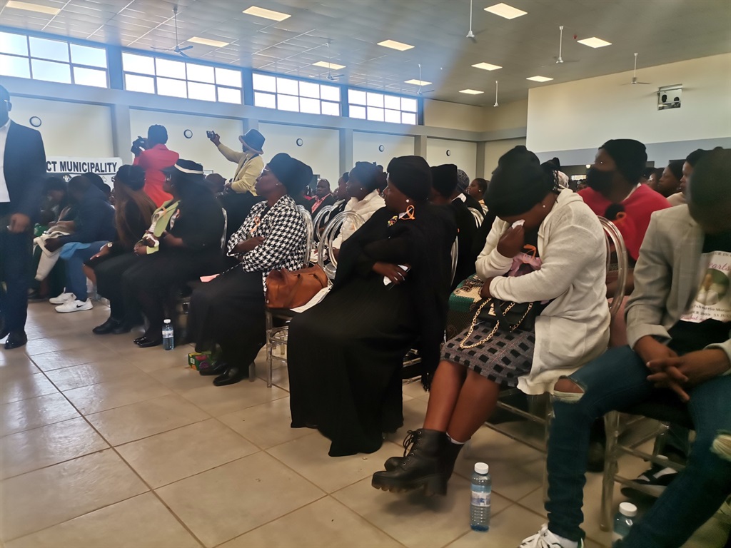 Mourners sobbing during the memorial service of th