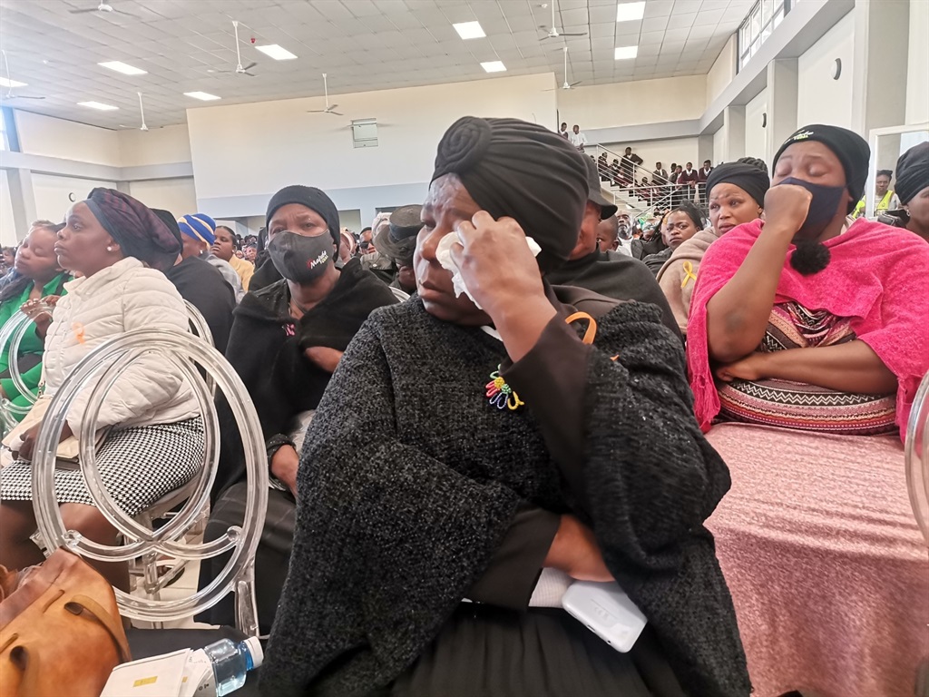 Mourners sobbing during the memorial service of th