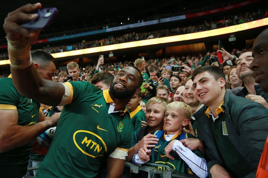 Springbok captain Siya Kolisi celebrating with fans following the team's win against the All Blacks on Saturday. (Bertram Malgas/News24)