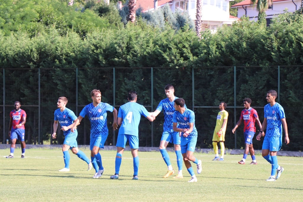 Al Shahaniya SC players celebrating after scoring 