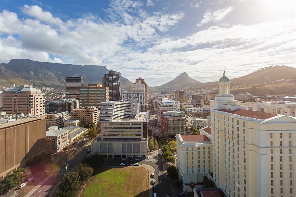 Cape Town Business District with skyscrapers and highrise buildings, underneath Table Mountain and Lions Head. (Mlenny/ Getty Images)