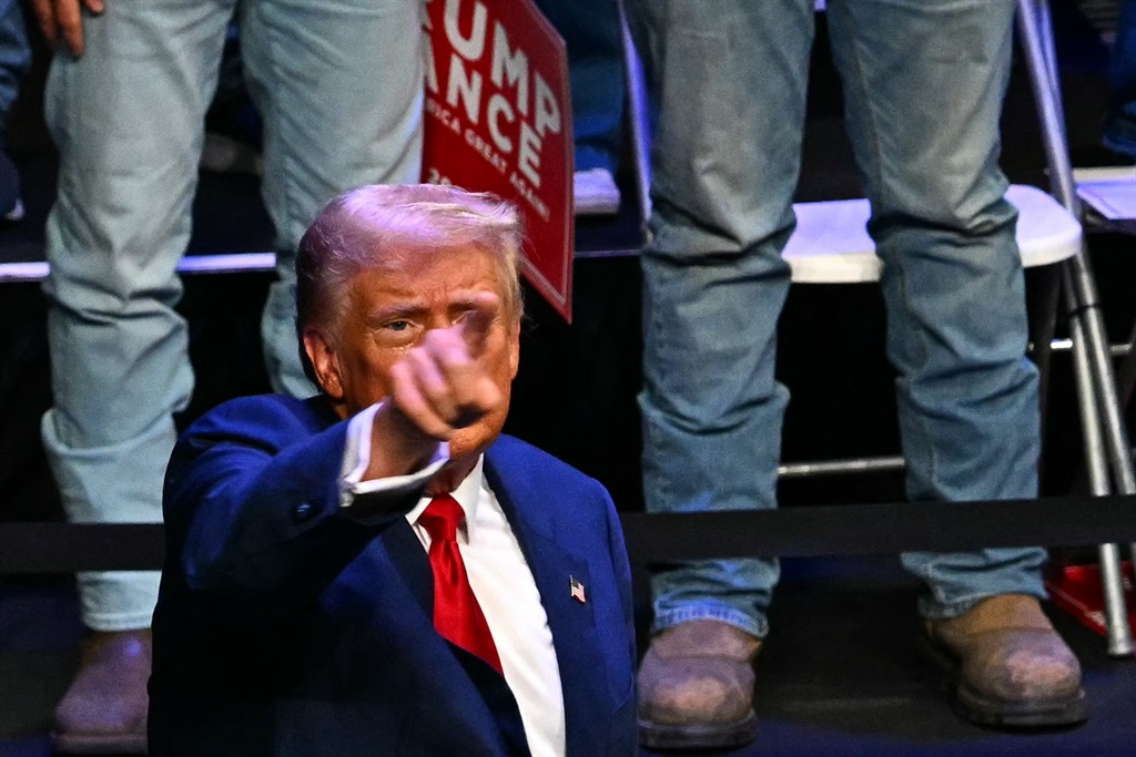 Former US President and Republican presidential candidate Donald Trump gestures to the audience after speaking at a campaign rally at Johnny Mercer Theatre Civic Center in Savannah, Georgia, on 24 September 2024. (Chandan Khanna/AFP)