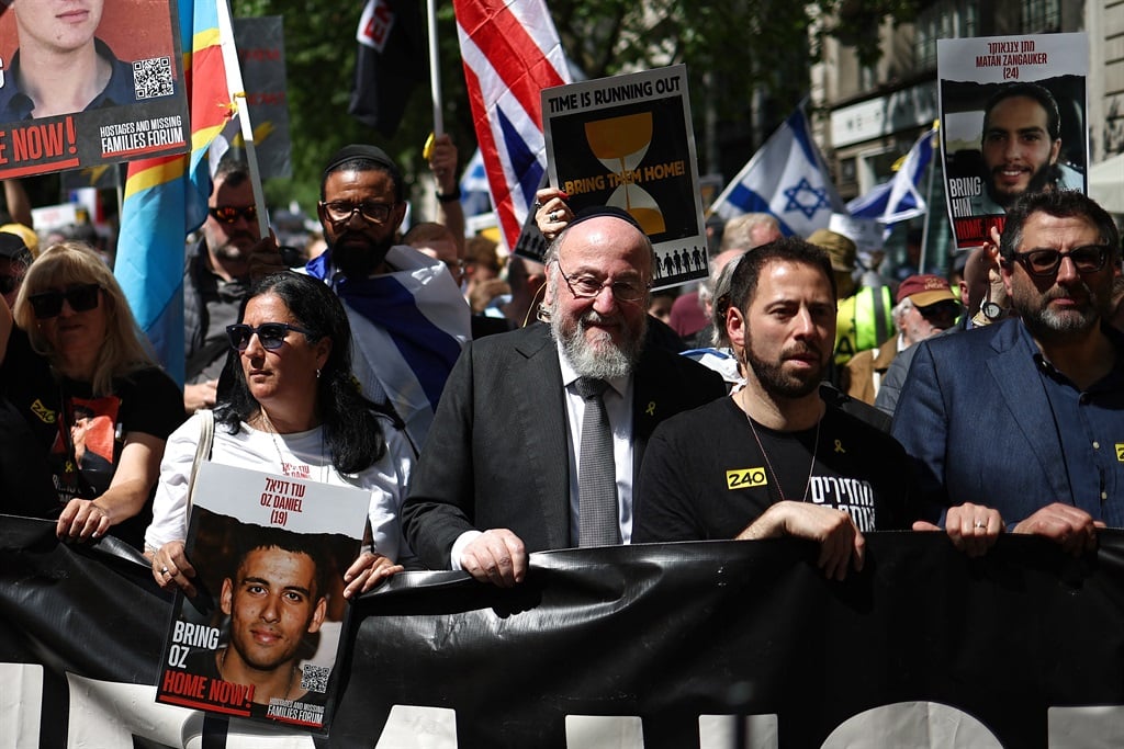 Chief Rabbi of the United Hebrew Congregations of the Commonwealth, Ephraim Mirvis (C) joins protesters taking part in a "United we Bring Them Home" march, in central London, on 2 June 2024, to bring attention to the plight of the hostages still held in Gaza. (Henry Nicholls/AFP)